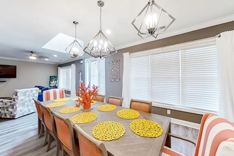 Spacious dining area perfect for family meals at Divine By The Beach rental